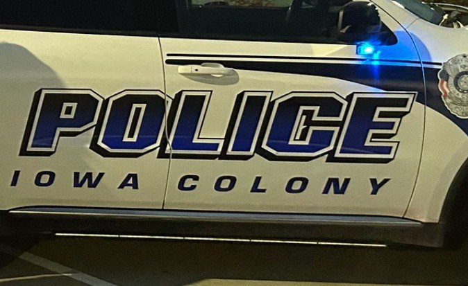 Driver Arrested by Iowa Colony Officers After Pursuit Ends With Vehicle Submerged in Retention Pond