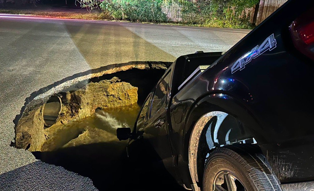 Pickup Truck Swallowed by Massive Sinkhole After Water Main Break in Beaumont